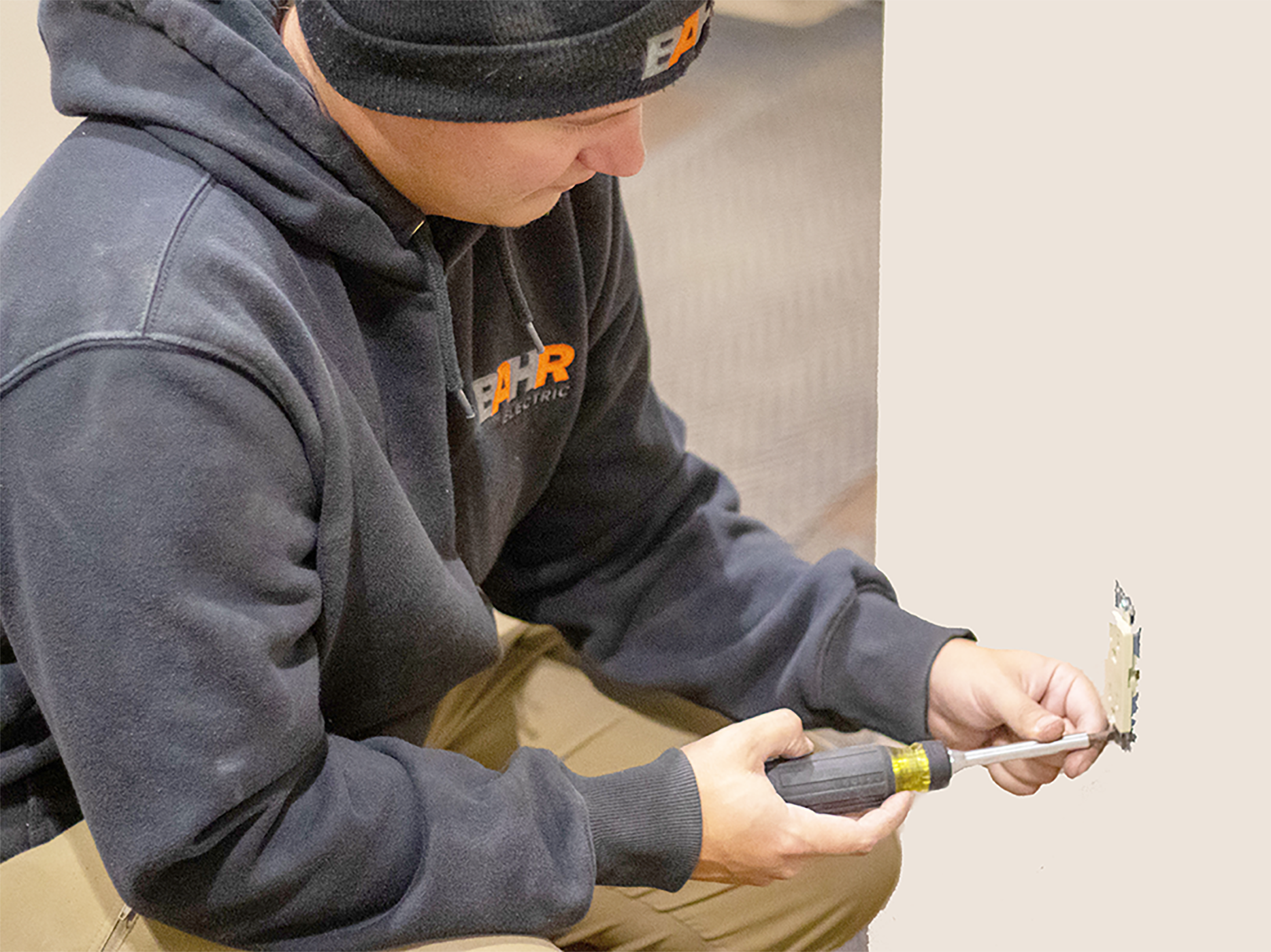 man working on outlet